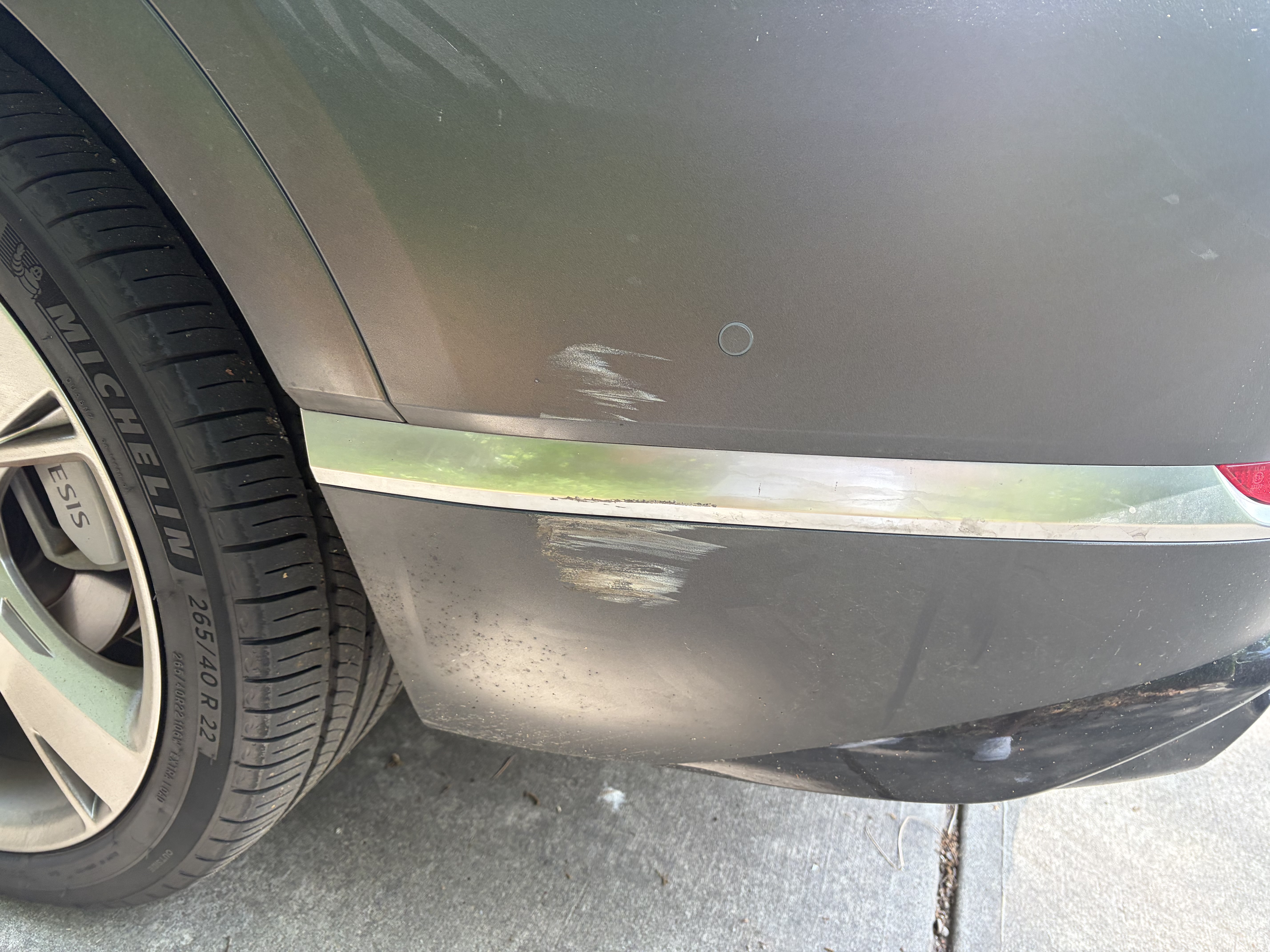 Genesis front bumper with damage before repair