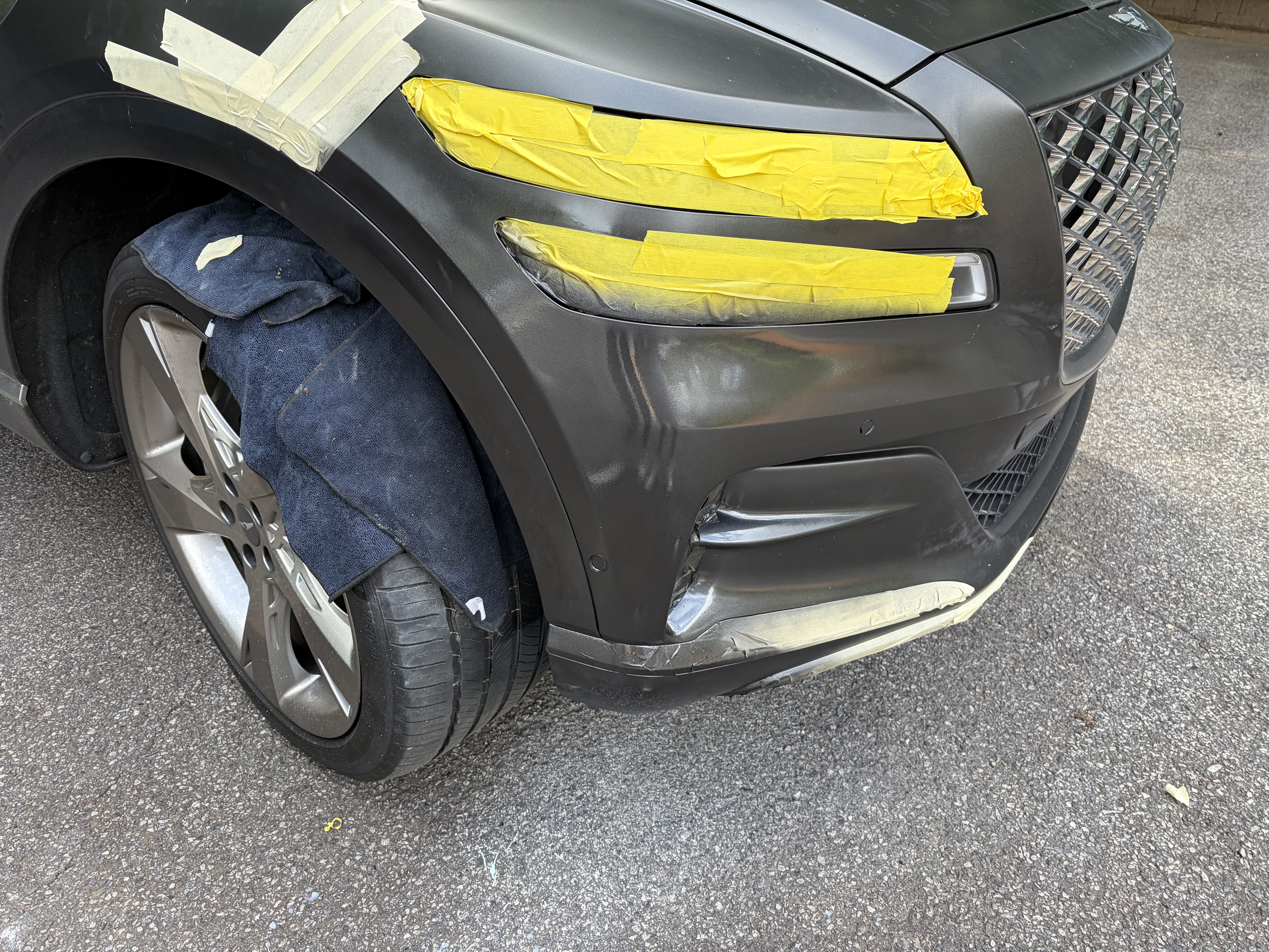 Genesis bumper being prepped for professional repair
